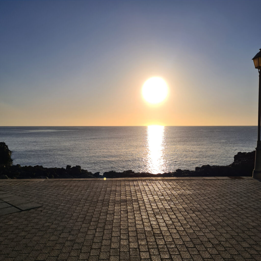 sun over seafront